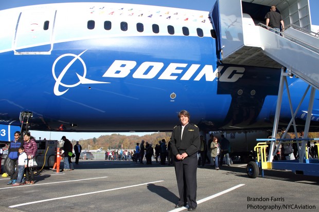 Captain Heather Ross stands next to ZA003 at the Museum of Flight