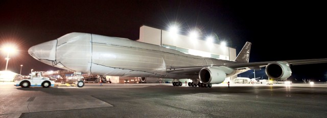 With the AvGeeks of today, Boeing has to get creative to hide a new livery. Here is the first 747-8I all covered before the big reveal - Photo by Boeing