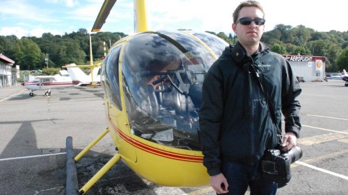 AirlineReporter's own Bernie Leighton stands in front of a helicopter at Boeing Field (BFI) - Photo: Britton Staniar | Bloomberg News