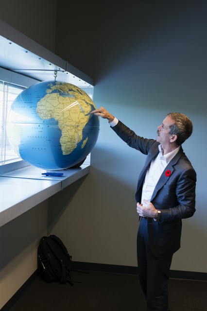 Canadian astronaut Chris Hadfield describes features of the planet while giving a talk at the Future of Flight. Photo: Kris Hull