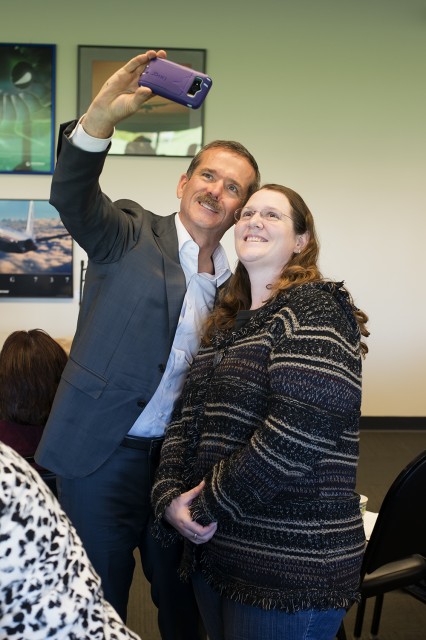 Canadian astronaut Chris Hadfield takes a "selfie" with a guest at the Future of Flight. Photo: Kris Hull