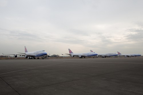 Four of the carriers 31 total 747 fleet sit on a ramp outside the hangar.