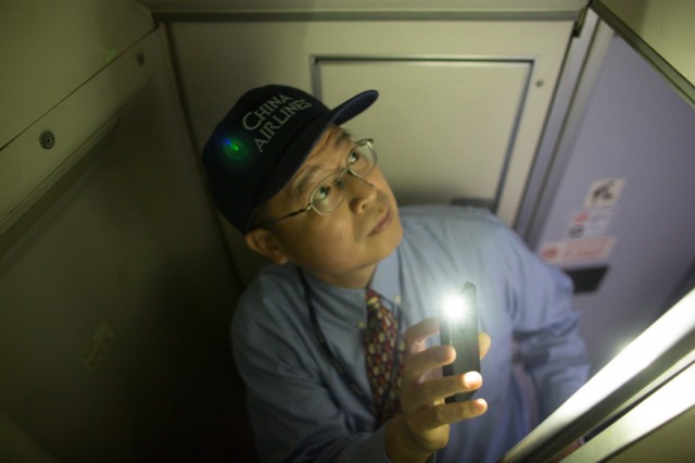 Boeing fleet manager Chieh-Li "Jerry" Wang takes a look inside the rear crew-rest of the Boeing 747.