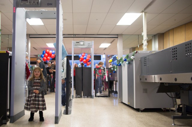 En route to meet her North Pole flight with Delta, a child passes through security at SeaTac International Airport on December 9, 2014. Delta teamed up with Down Syndrome Community of Puget Sound to send 80 kids and their families on a trip to see Santa.