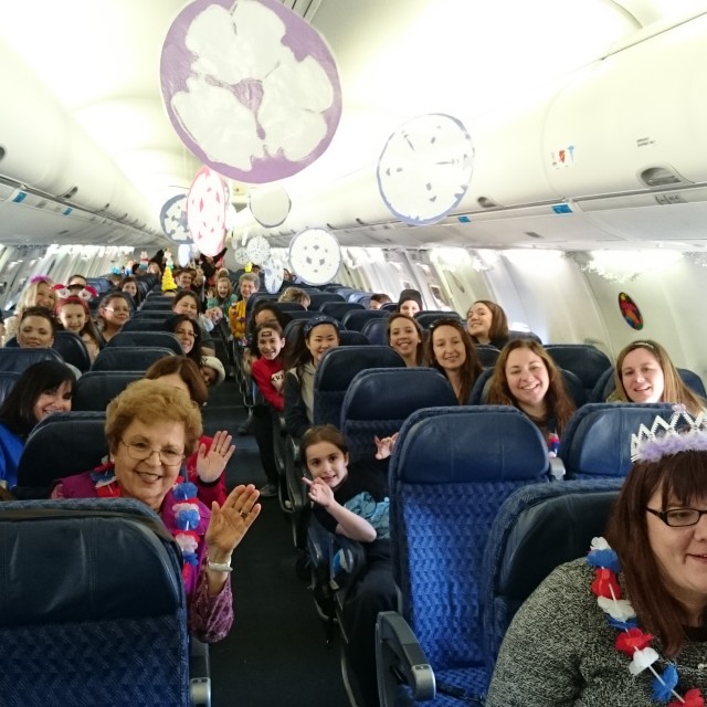Happy passengers enjoying the decorations on the Snowball Express - Photo: Jason Rabinowitz