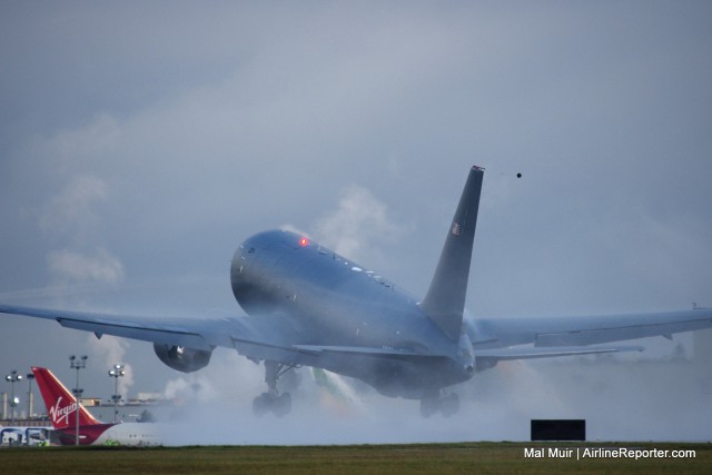 The first 767-2C is now airworthy after creating large rooster tails down a wet runway in Everett.