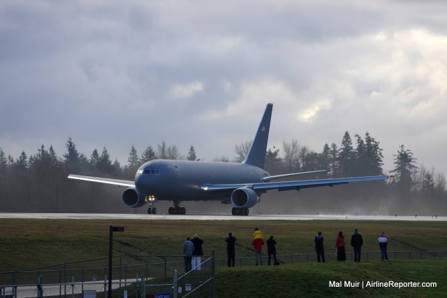 People line up beside the runway at the ever popular "Windsock" at Paine Field on a Rainy Sunday morning.  The 767-2C is just about to begin its maiden flight.