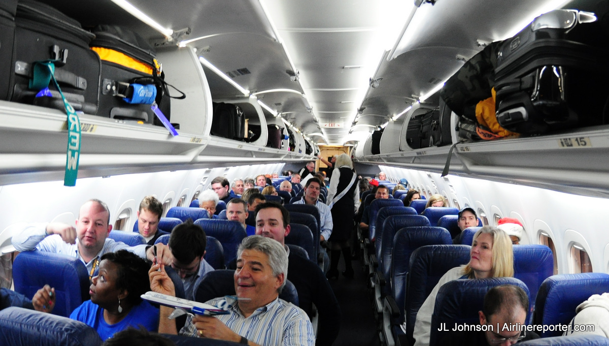 Passengers slowly fill up AirTran flight 1.