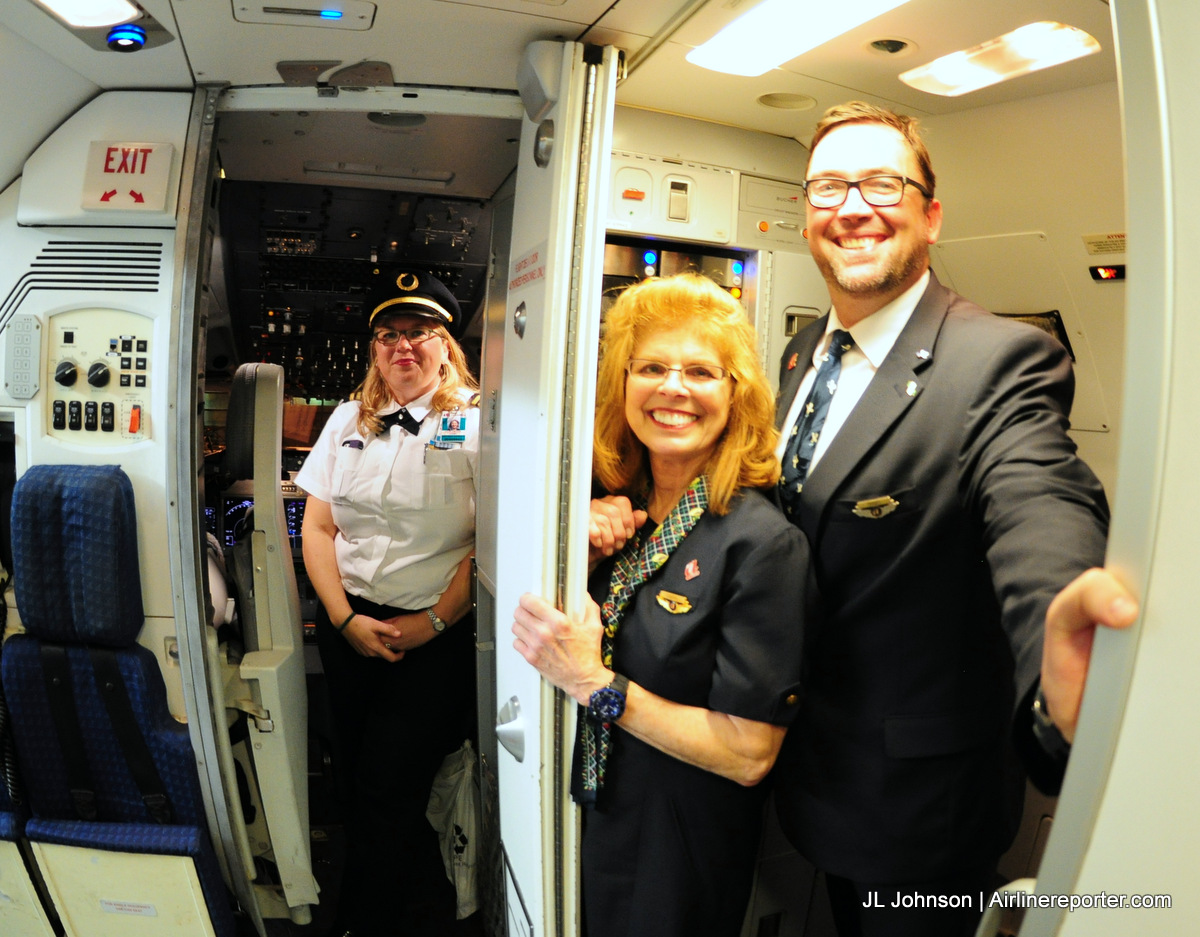 AirTran flight 1 crew gives one last goodbye to passengers as the deplane.