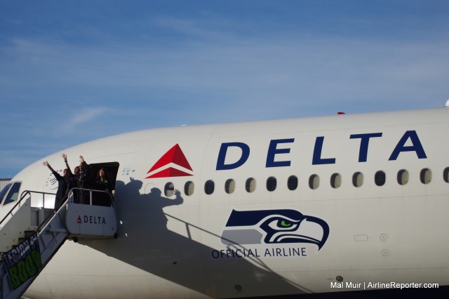 Doug Baldwin, Wide Receiver for the Seattle Seahawks, waves goodbye to Delta Staff, Family & Friends as they get ready to depart for Phoenix & Superbowl 49 - Photo: Mal Muir | AirlineReporter.com