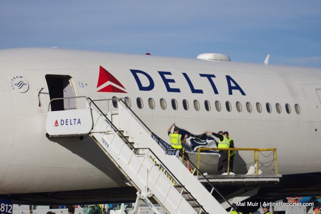 A special Seahawk's sticker was emblazoned on the aircraft just for the departure event.  It was not flight rated and that same aircraft was flying to Boston the next day to pick up the New England Patriots - Photo: Mal Muir | AirlineReporter.com