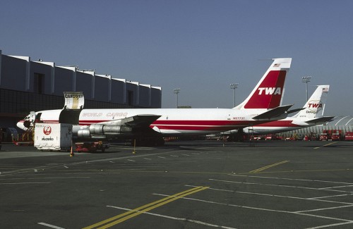 Two different tail liveries on these TWA Boeing 707 Cargo jets - Photo: George Hamilton