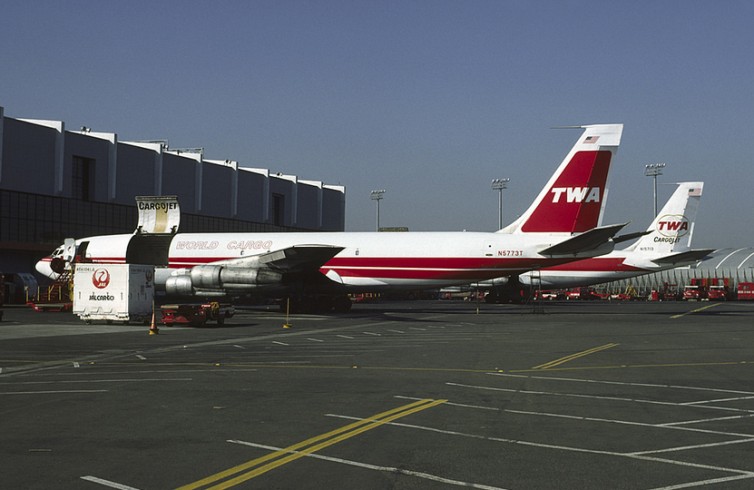 Two different tail liveries on these TWA Boeing 707 Cargo jets - Photo: George Hamlin
