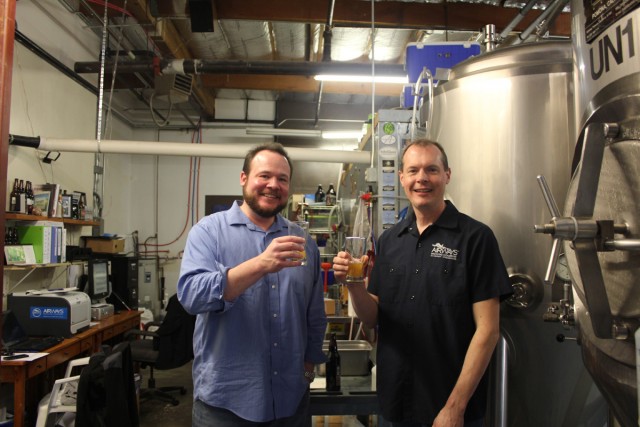 Alex and me in the brewery where I tried #AvGeek beer for the first time. Check the sweet stickers in the background - Photo: David Parker Brown