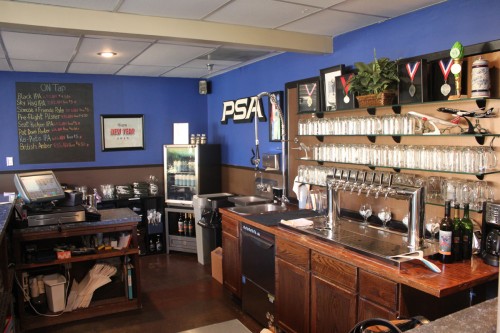 The brewery and taproom where the serving happens. Notice the PSA sign on the wall - Photo: David Parker Brown