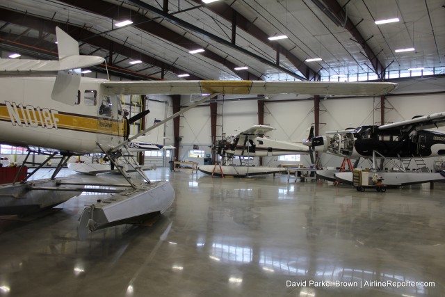 Multiple planes are being worked on inside Kenmore Air's new hangar 