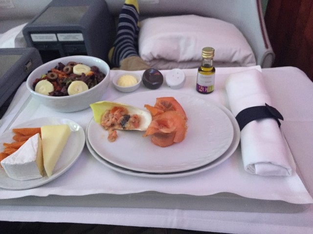 Nice starter to dinner.  Don't mind my socks, I was in lounge mode - Photo: Blaine Nickeson | AirlineReporter