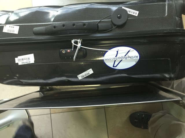 Checked luggage heading to the Galapagos is zip-tied shut to prevent smuggling. Photo - Bernie Leighton | AirlineReporter
