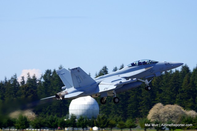 An EA-18G Growler from VAQ-129 climbs out of NOLF Coupeville in Full Afterburner