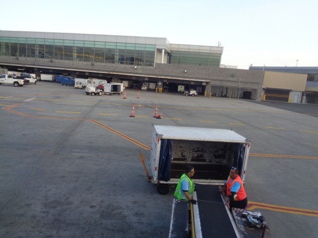 A common scene around an airport.  Ramp Workers waiting... waiting... more waiting.  Photo: Anonymous Plane Passenger