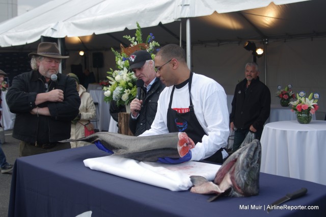 Tom Douglas talks about salmon, while it is filleted