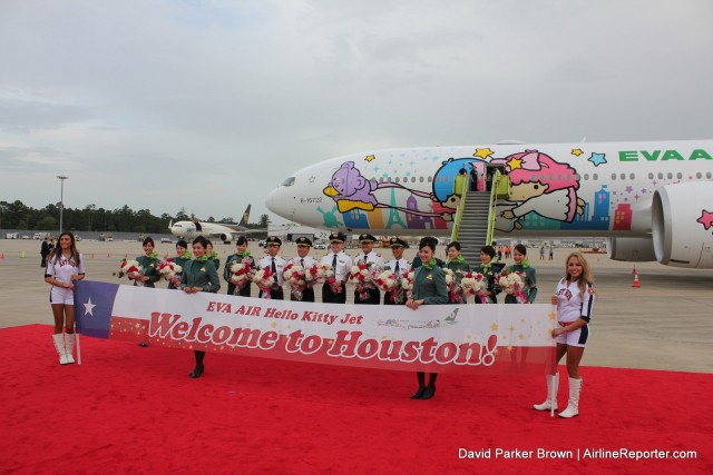 The flight crew joined some cheer leaders for a photo op