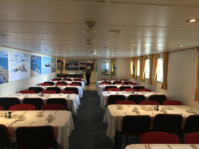 The dining room wraps around the rear of Deck 4, it can seat every passenger at once. Oddly, the actual galley is on Deck 3. - Photo: Bernie Leighton | AirlineReporter