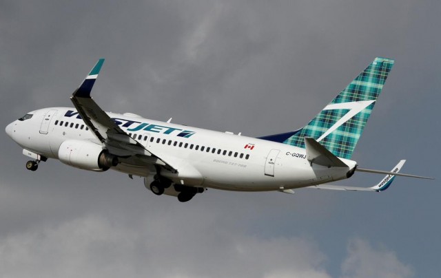 One of WestJet's two Tartan Tail 737s, with the airline's regular fuselage logo.