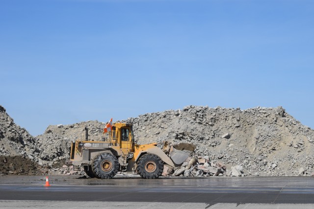 Concrete excavated from the old runway, waiting to be recycled. - Photo: Lauren Darnielle | AirlineReporter