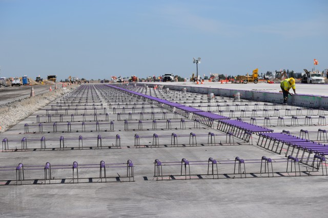 At the north end of the runway, supports are being placed in preparation for pouring another concrete panel. - Photo: Lauren Darnielle | AirlineReporter