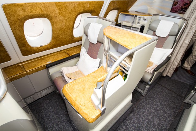 While the business cabin layout is nice, the decor is a bit too much with the faux wood finishes Photo: Jacob Pfleger | AirlineReporter