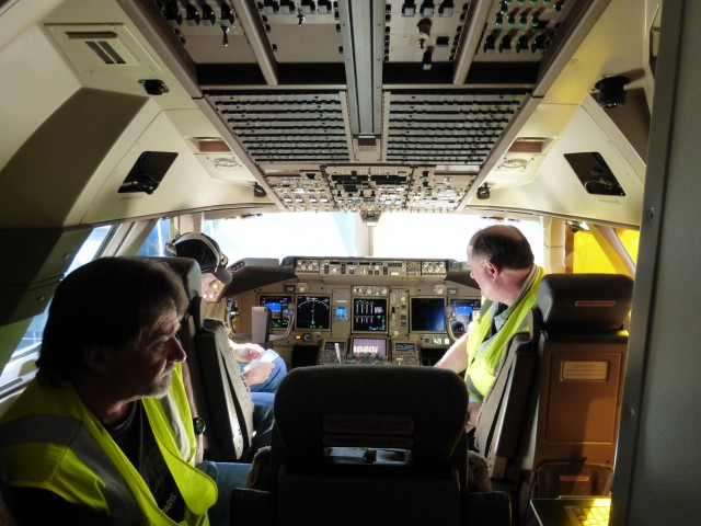 Boeing engineers preparing the 747-8I for departure to Seoul - Photo: Colin Cook | AirlineReporter