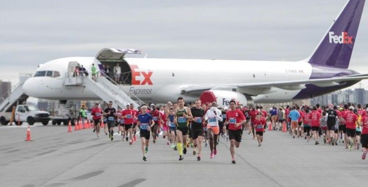 Toronto Pearson Runway Run participants run with FedEx freighters. Photo: Greater Toronto Airports Authority 