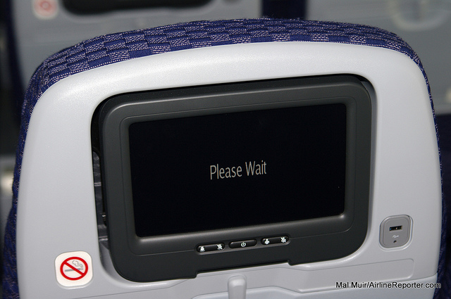 Please wait, a message on a United IFE screen