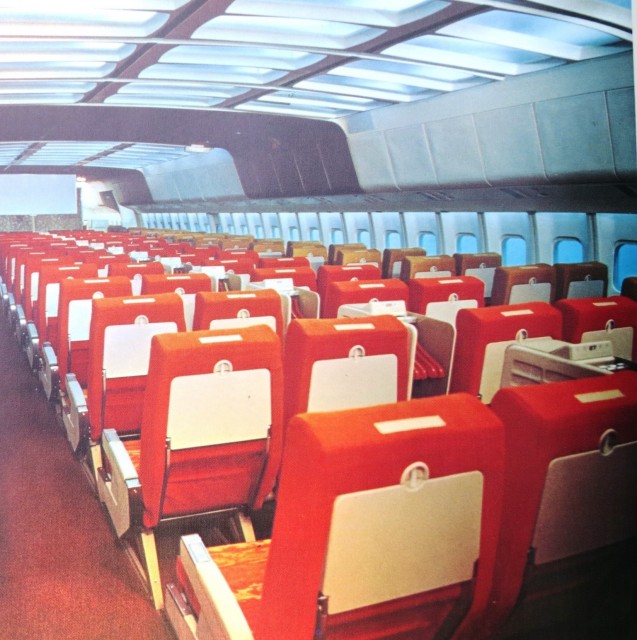 Coach cabin of the L-1011 with center line stowage modules.