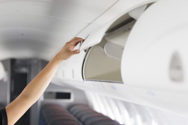 Larger bins on board the E-175 can hold standard rollaboard suitcases. Photo: American Airlines