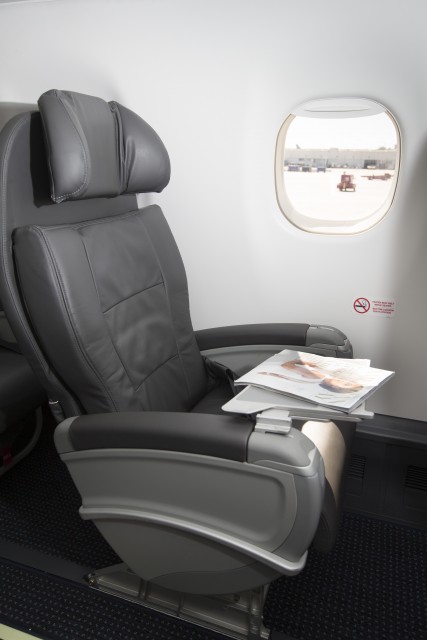 Single first class seat on board an American Eagle E-175 at LAX. Photo: American Airlines