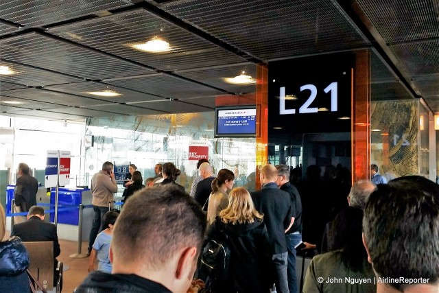 Passengers in queue to board at CDG's Gate L21