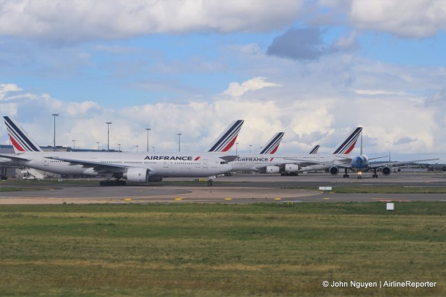 A Vietnam Airlines 777-200ER photobombs an Air France gathering.