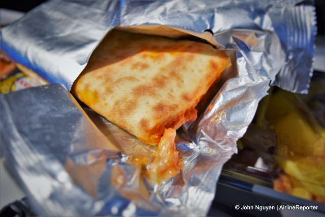 Inside the mystery bag? A warm cheese-and-tomato flatbread as part of an Economy meal on Air France, CDG-IST.