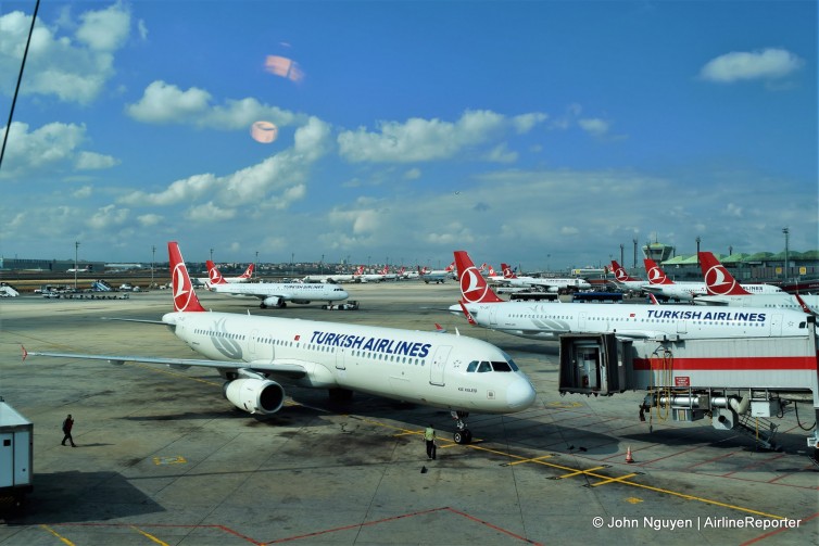 Foreground: A Turkish Airlines A320 pulling into the International Terminal at IST.