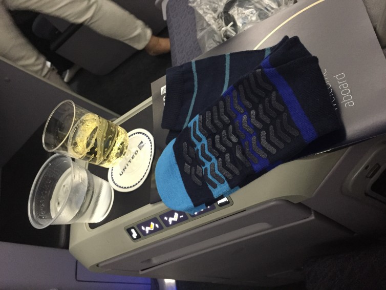 Cool socks in the amenity kit, along with Champagne service - Photo: Blaine Nickeson | AirlineReporter