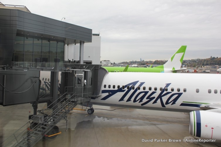 Alaska Airlines flight attendant Jenn-Marie Mann and I rock putting my bag in the bin