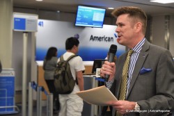 Kyle Mabry addresses the passengers waiting to board the inaugural American flight from LAX to SYD.