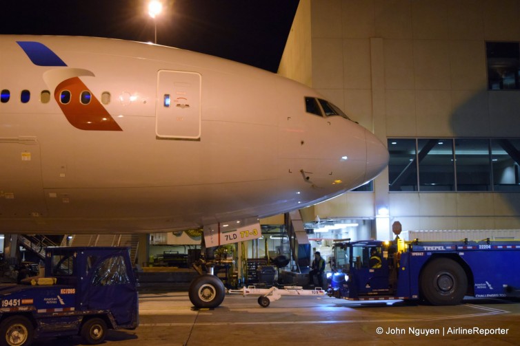 An American Airlines 777-300ER (N720AN) bound for SYD from LAX, parked at Gate 41.