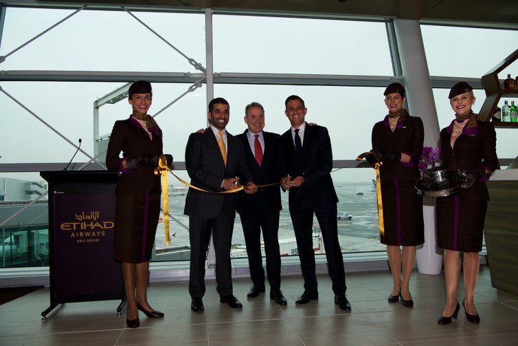 Etihad CEO James Hogan (the man in the middle) and other Etihad executives officially open the new lounge - Photo: Bernie Leighton | AirlineReporter