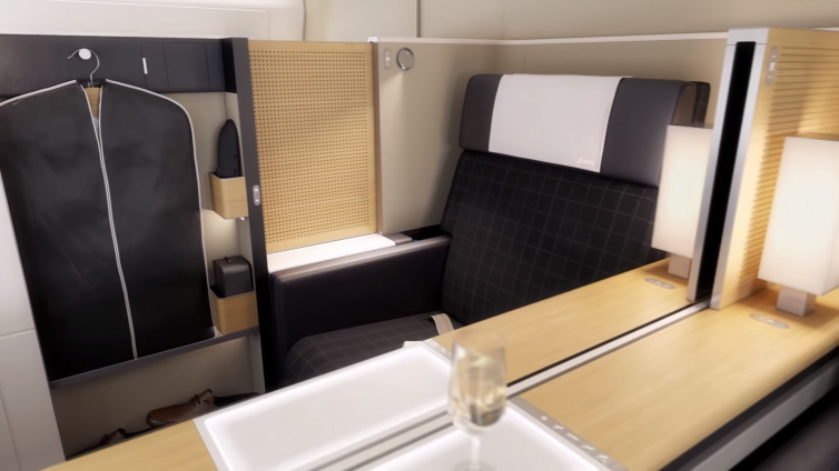 Note the wardrobe and retracted divider for Swiss's new First Class seats. Image: Youtube | Swiss