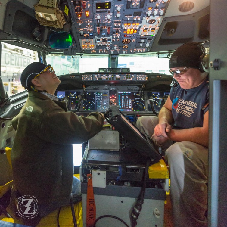 Workers testing cockpit equipment in the No. 2 test aircraft for the 737 MAX program.