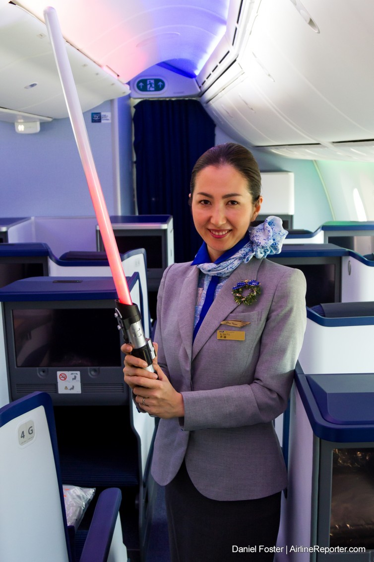 Chief Purser N. Saito demonstrates her skills with a lightsabre