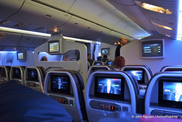 The view from regular economy on American's 777-300ER, with partitions separating Main Cabin Extra from the rest of coach.